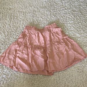 Coral pink skirt.